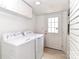 Functional laundry room with a washer, dryer, and white walls at 536 Carroll St, Statesville, NC 28625