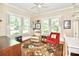 Bright living room with large windows, hardwood floors, and a comfortable seating area; perfect for relaxation and entertainment at 536 Carroll St, Statesville, NC 28625