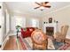 Inviting living room with hardwood floors, fireplace, ceiling fan, and natural light at 536 Carroll St, Statesville, NC 28625