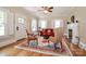 Cozy living room with hardwood floors, fireplace, and large windows with white shutters at 536 Carroll St, Statesville, NC 28625