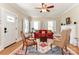 Inviting living room with hardwood floors, a fireplace, and bright natural light at 536 Carroll St, Statesville, NC 28625