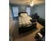 Blue bedroom with large window, a ceiling fan, and modern furniture at 571 Goldstaff Ln, Charlotte, NC 28273