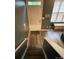 Entryway down stairs featuring wood floors, gray walls, and white door at 571 Goldstaff Ln, Charlotte, NC 28273