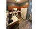 Bright and functional kitchen with ample counter space, white appliances and wood cabinetry at 571 Goldstaff Ln, Charlotte, NC 28273
