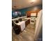 Efficient kitchen with white appliances, wood cabinets, and eat-in breakfast area at 571 Goldstaff Ln, Charlotte, NC 28273