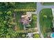 Aerial view showing the home's layout, landscaping, driveway, and surrounding lush greenery at 6302 Dwayne Starnes Dr, Hickory, NC 28602