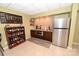 Finished basement bar area with custom shelving, tiled backsplash, stainless steel appliances at 6302 Dwayne Starnes Dr, Hickory, NC 28602