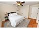 Cozy bedroom with hardwood floors, ceiling fan, and soft lighting, creating a peaceful retreat at 6302 Dwayne Starnes Dr, Hickory, NC 28602
