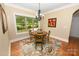 Dining area featuring hardwood floors, a chandelier, and a beautiful view of the outdoors at 6302 Dwayne Starnes Dr, Hickory, NC 28602