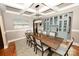 Elegant dining room featuring a coffered ceiling, a long wooden table, and a built-in display cabinet at 6302 Dwayne Starnes Dr, Hickory, NC 28602