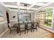 Dining room highlighting the coffered ceiling, a large window and a wooden table with seating for eight at 6302 Dwayne Starnes Dr, Hickory, NC 28602