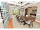 Dining room exhibiting a coffered ceiling, built in cabinet, and a large wooden table with seating at 6302 Dwayne Starnes Dr, Hickory, NC 28602