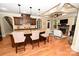 Open kitchen view with granite island, stainless steel appliances, and seamless access to the living room at 6302 Dwayne Starnes Dr, Hickory, NC 28602