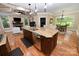 Spacious kitchen featuring an island with a sink, stainless steel appliances, and hardwood floors at 6302 Dwayne Starnes Dr, Hickory, NC 28602
