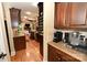 Open-concept kitchen leading to the living room, featuring stainless steel appliances and custom cabinetry at 6302 Dwayne Starnes Dr, Hickory, NC 28602