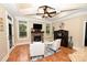 Cozy living room with stone fireplace, built-in bar, large windows, and coffered ceilings at 6302 Dwayne Starnes Dr, Hickory, NC 28602