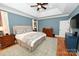 Spacious bedroom features a tray ceiling, neutral-toned walls, and hardwood floors, creating a calming atmosphere at 6302 Dwayne Starnes Dr, Hickory, NC 28602