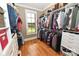 Well-organized walk-in closet with ample hanging space, shelving, and natural light from the window at 6302 Dwayne Starnes Dr, Hickory, NC 28602