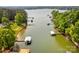 Breathtaking aerial view showcasing the lake and boat docks, with lush green trees and clear water at 669 Kenway Loop, Mooresville, NC 28117
