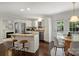 Bright kitchen boasts granite counters, stainless steel appliances, and access to the outdoor area at 6938 Wrentree Dr, Charlotte, NC 28210