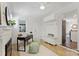 Bright space features a modern desk, fireplace, and ample natural light at 6938 Wrentree Dr, Charlotte, NC 28210