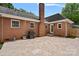 Spacious backyard patio with BBQ grill and access to the home's rear entrance at 6946 Woodstock Dr, Charlotte, NC 28210