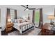 Comfortable bedroom with natural light, dark wood floors, and space for a home office at 6946 Woodstock Dr, Charlotte, NC 28210