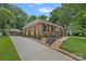 Charming single-Gathering home with manicured front yard and long driveway at 6946 Woodstock Dr, Charlotte, NC 28210