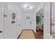 Inviting foyer features hardwood floors, fresh paint, and stylish lighting at 6946 Woodstock Dr, Charlotte, NC 28210