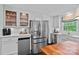 Gourmet kitchen featuring stainless steel appliances, white countertops and ample storage at 6946 Woodstock Dr, Charlotte, NC 28210