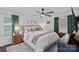 Spacious main bedroom with neutral tones, a ceiling fan, and bright natural light at 6946 Woodstock Dr, Charlotte, NC 28210