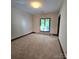 Sunlit bedroom featuring a large window offering natural light at 695 Knollcrest Ne Dr, Concord, NC 28025