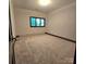 Neutral bedroom featuring carpet flooring and a single window at 695 Knollcrest Ne Dr, Concord, NC 28025