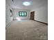 Spacious bedroom with carpet, natural light, and two large windows at 695 Knollcrest Ne Dr, Concord, NC 28025