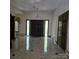 Grand entryway with double doors, tiled floor, chandelier, and an abundance of natural light at 695 Knollcrest Ne Dr, Concord, NC 28025