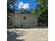 Brick home with two-car garage and stairway to a second story deck and entrance at 695 Knollcrest Ne Dr, Concord, NC 28025