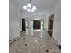 A grand foyer with patterned tile flooring, elegant lighting, and solid wood doors, creating a welcoming entrance at 695 Knollcrest Ne Dr, Concord, NC 28025