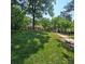 Beautifully landscaped front yard and walkway leading to the charming home at 695 Knollcrest Ne Dr, Concord, NC 28025