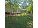 Charming brick home with mature trees and well-maintained landscaping at 695 Knollcrest Ne Dr, Concord, NC 28025