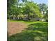 Lovely brick home surrounded by mature trees and a well-manicured lawn at 695 Knollcrest Ne Dr, Concord, NC 28025