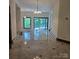 Spacious living room featuring tile flooring, and access to the outdoor deck area at 695 Knollcrest Ne Dr, Concord, NC 28025