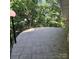 Spacious tiled patio with a black railing and globe lighting providing an ideal outdoor entertainment or relaxation area at 695 Knollcrest Ne Dr, Concord, NC 28025
