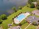 Aerial shot of a large community pool, clubhouse, with lake views and ample lounge seating at 705 Congressional Ln, Fort Mill, SC 29708