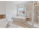 Inviting bathroom with separate walk-in shower, jetted tub, and neutral tile at 705 Congressional Ln, Fort Mill, SC 29708