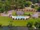 Aerial view of community pool with ample seating, jacuzzi and surrounding well-maintained landscaping at 705 Congressional Ln, Fort Mill, SC 29708