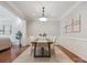 Dining room with hardwood floors, natural light, and a decorative chandelier at 705 Congressional Ln, Fort Mill, SC 29708
