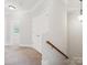 This carpeted hallway offers closet space and a decorative light fixture at 705 Congressional Ln, Fort Mill, SC 29708