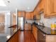 Kitchen featuring stainless steel appliances, granite countertops, and wood cabinets at 705 Congressional Ln, Fort Mill, SC 29708