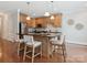Kitchen featuring an island with seating, stainless steel appliances, and wooden cabinetry at 705 Congressional Ln, Fort Mill, SC 29708