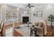 Inviting living room with fireplace, ceiling fan, large window, and natural light at 705 Congressional Ln, Fort Mill, SC 29708